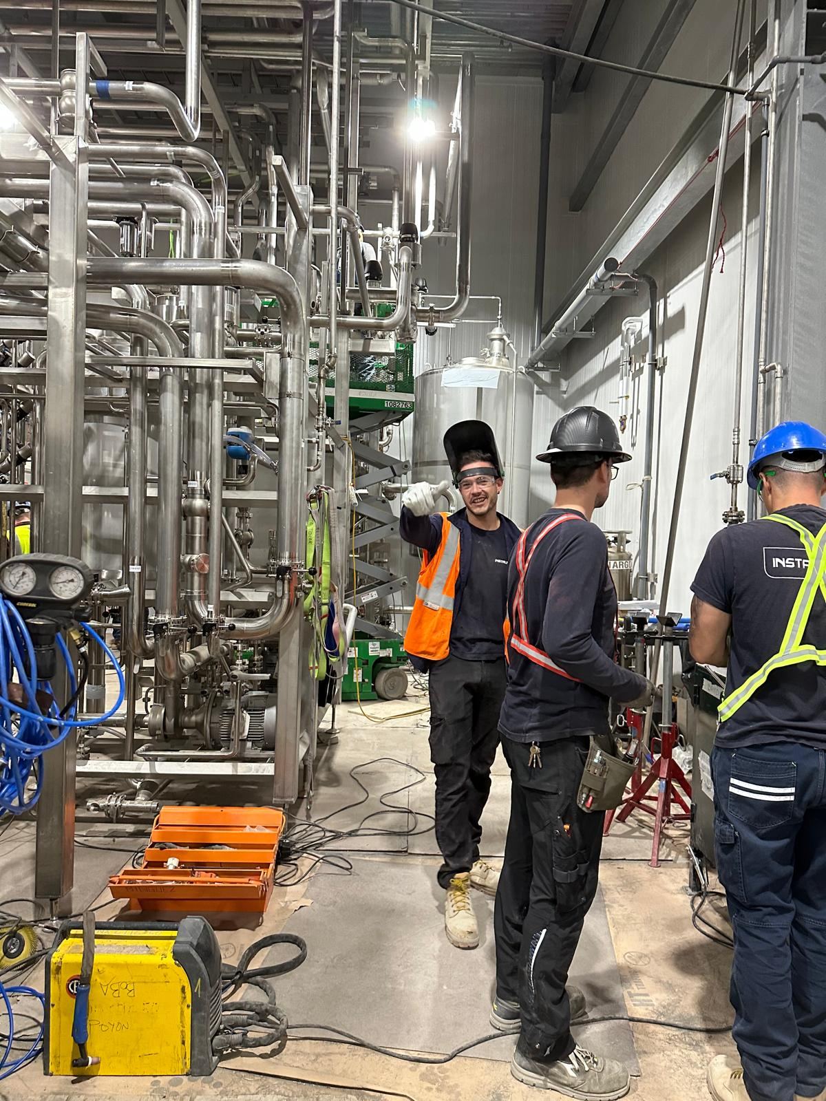 Pipefitters and welders at work