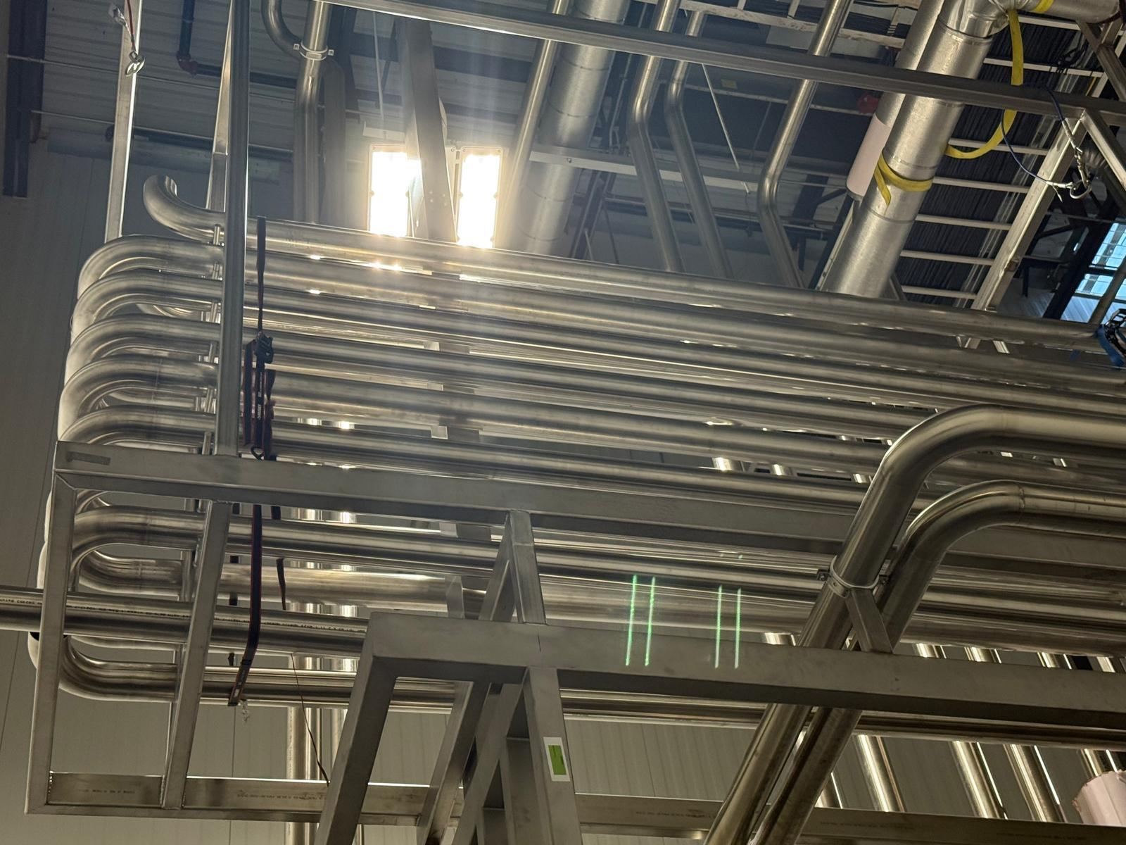 Stainless steel process piping racks installed by our crews