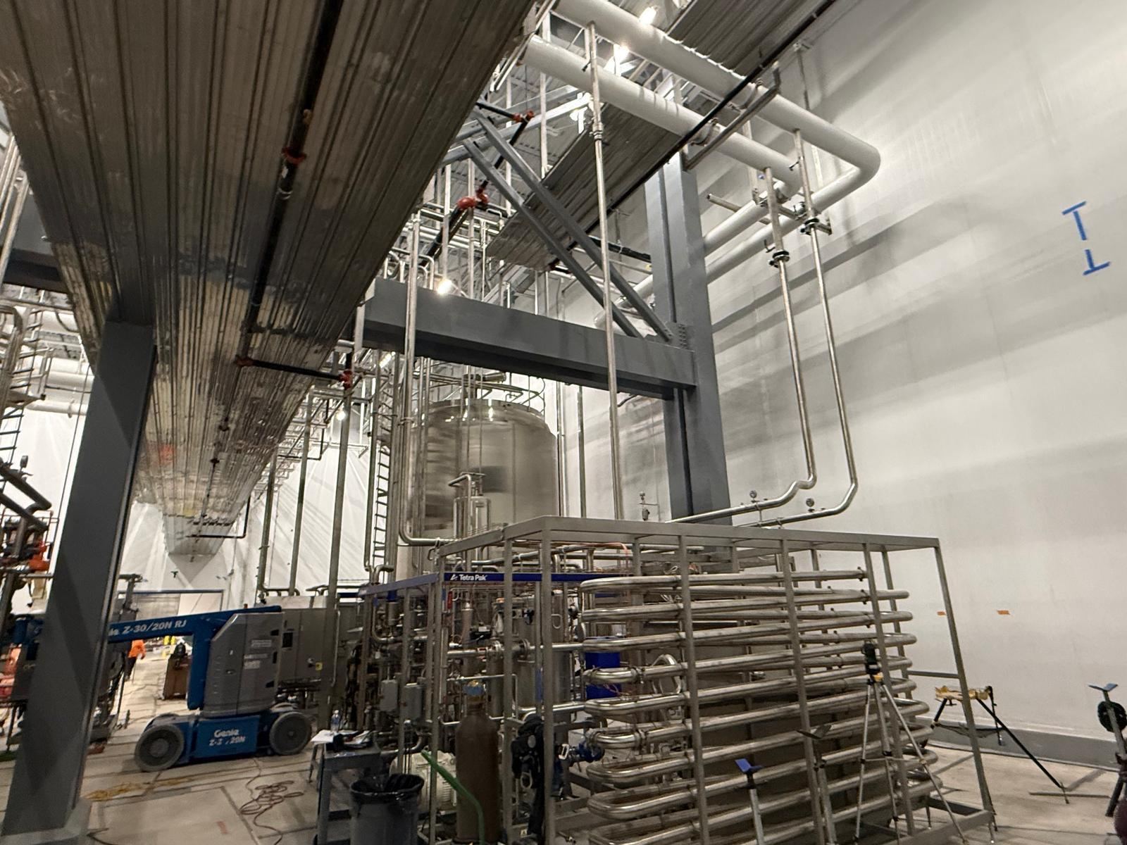 Stainless process piping racks and pipe spools on site
